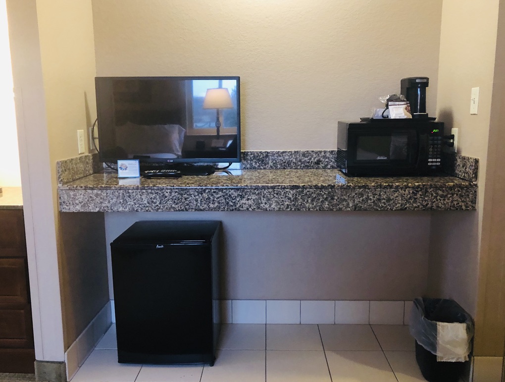 Zehnder's Splash Village Family Suite mini kitchen area with microwave, coffee maker, and mini fridge. 
