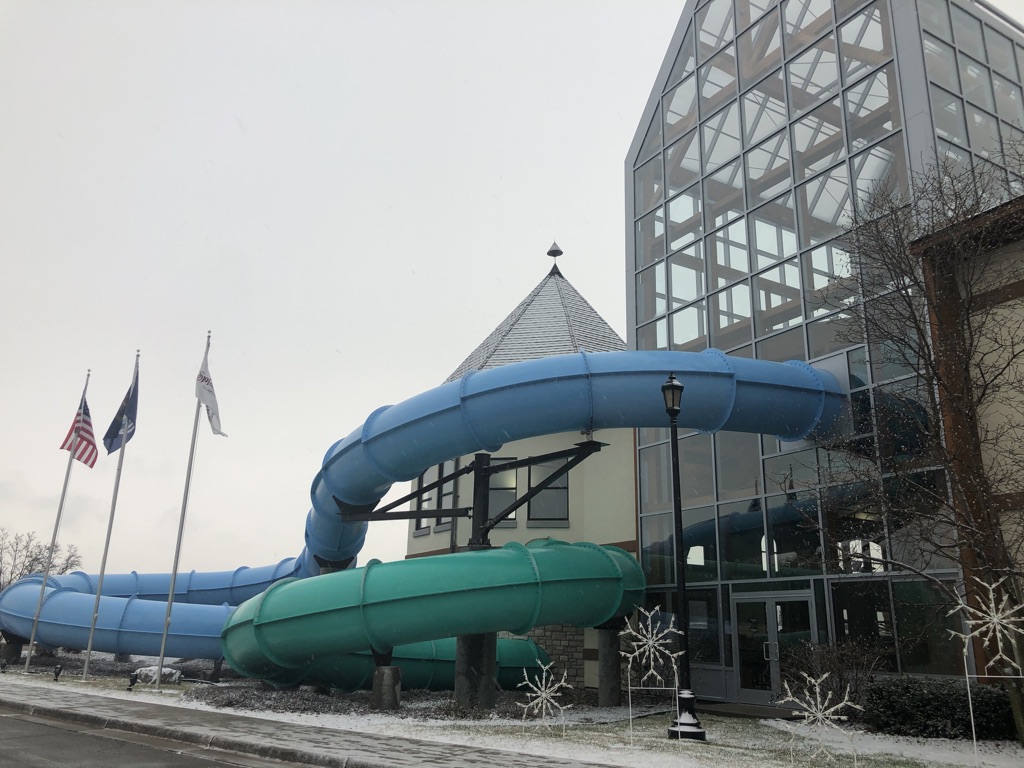 Water slides coming out of the Zehnder's Splash Village building - Waterpark hotels in Michigan