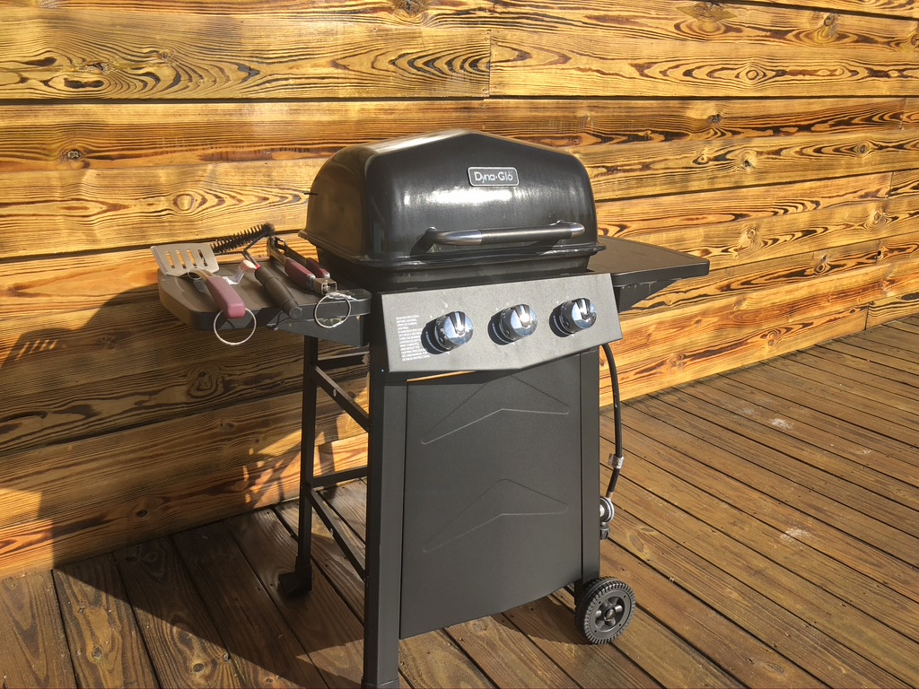 Outdoor gas grill on back pool area