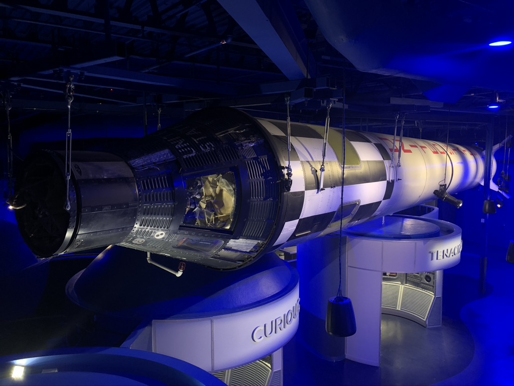 A Redstone rocket and Sigma 7 capsule suspended from the ceiling inside the Heroes and Legends building.