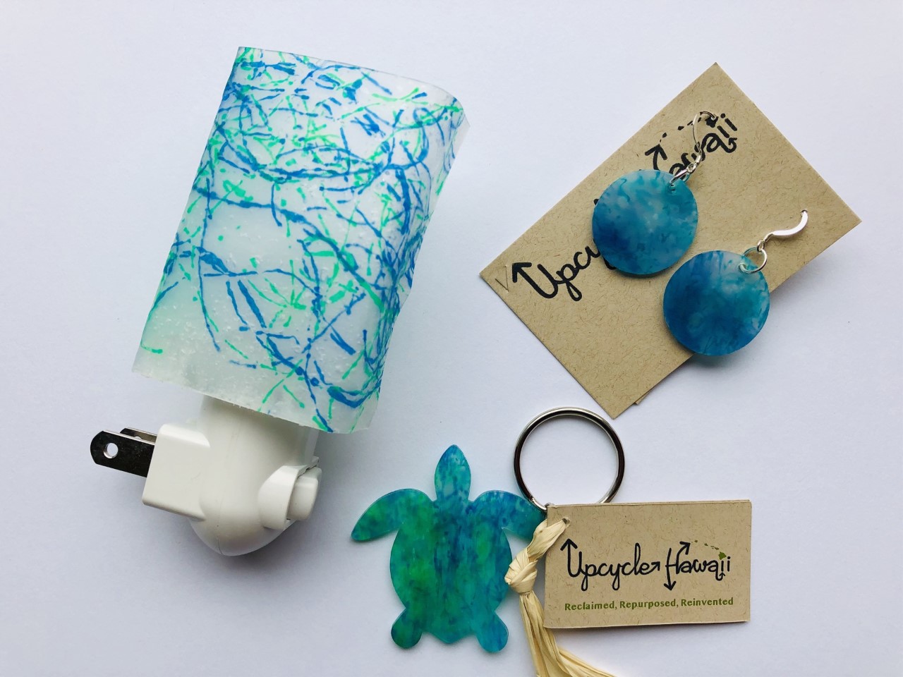 Melted marine debris nightlight, earrings and keyring by Upcycle Hawaii. 