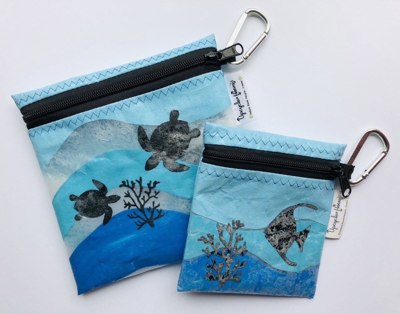 Hand-painted, fused plastic zipper pouches by Upcycle Hawaii. 