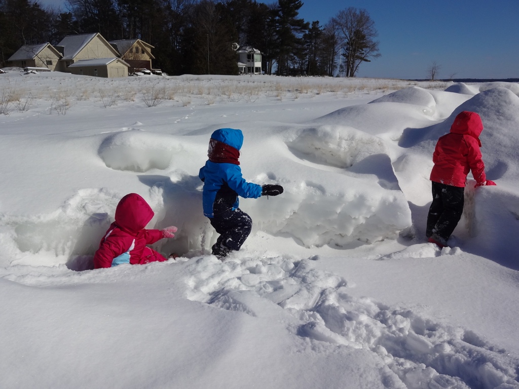 Children walking on the frozen lake. 