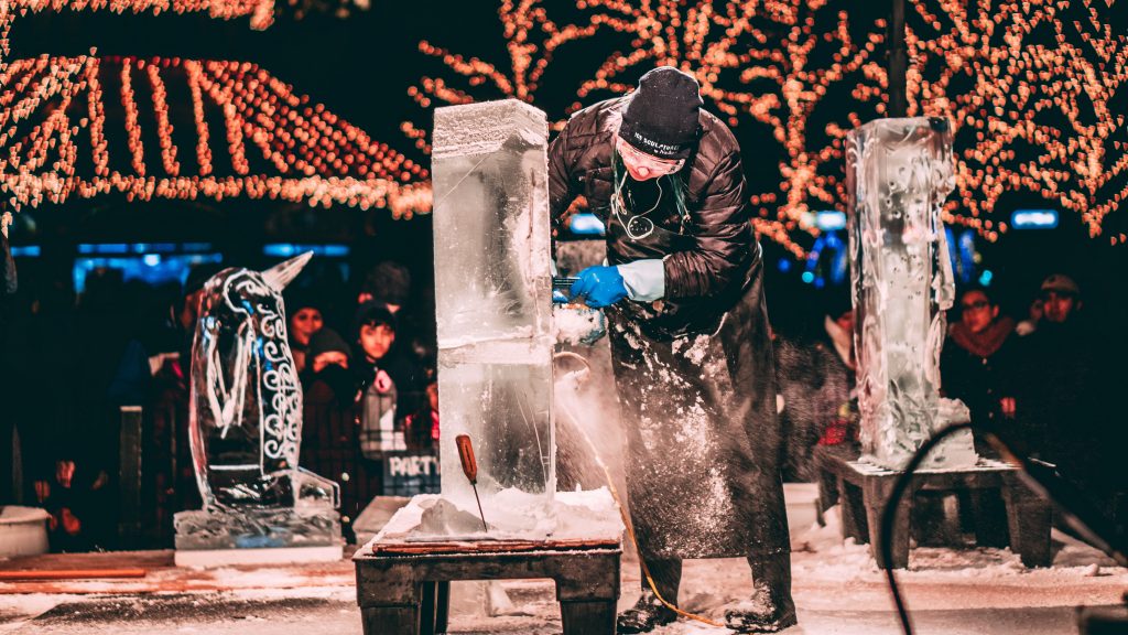 An ice sculptor working on a sculpture.  