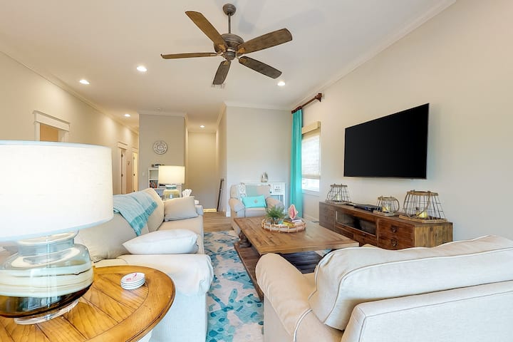 Coastal feeling living area with bright blues on white