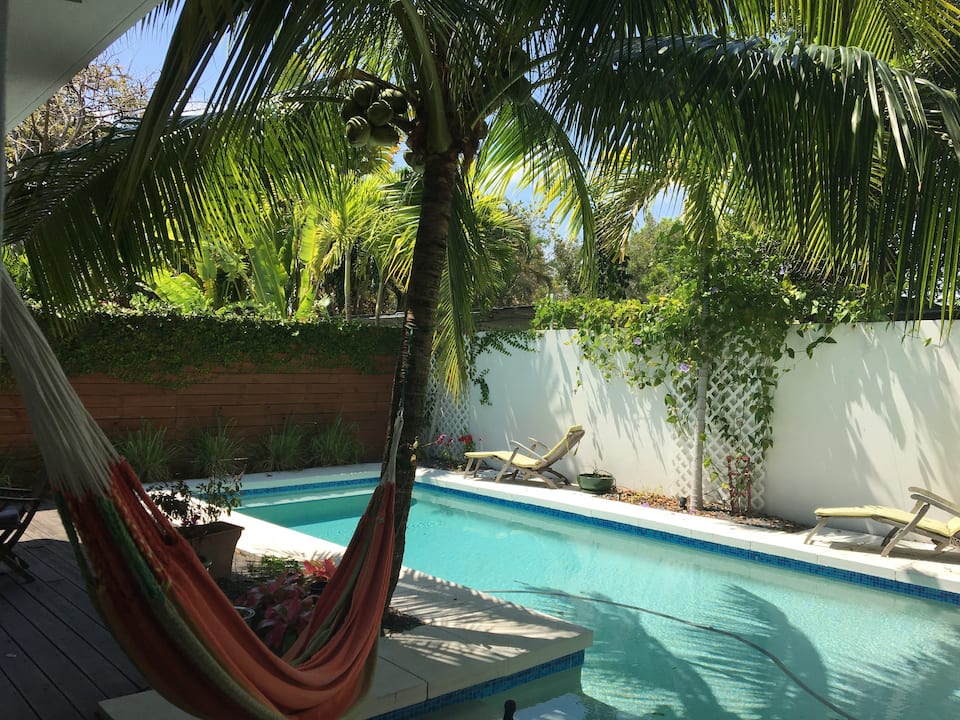 Outdoor pool and hammock area at one of our choices for Best family Airbnb Florida