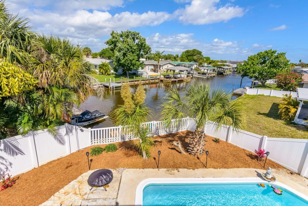 backyard pool overlooking a water canal in Florida