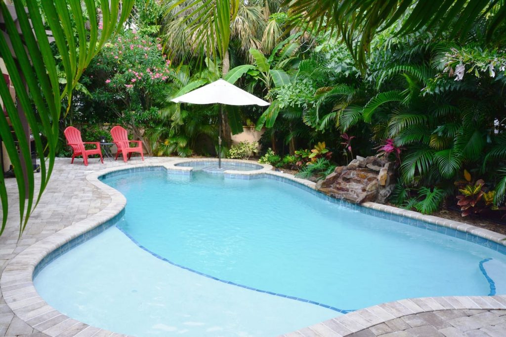 Heated pool with waterfall and private lanai.  Our choice for Best family Airbnb Florida, Holmes Beach area of Anna Maria Island. 