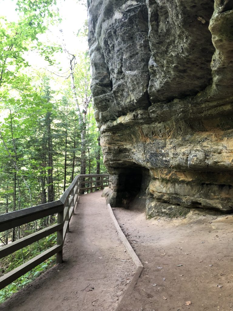 Gravel path along walls of rocks to the upper viewing area of Munising Falls. 