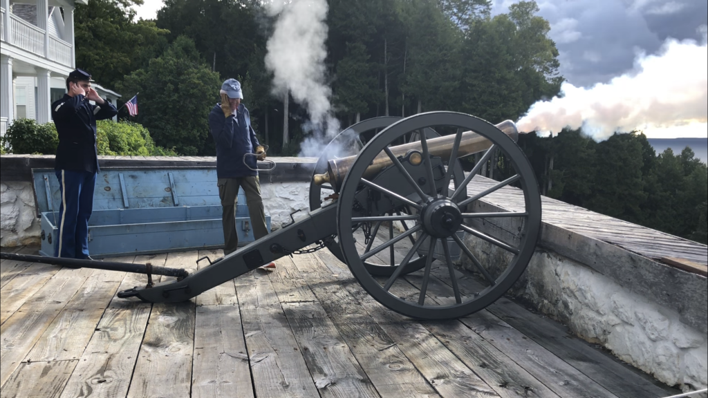 Fort Mackinac History - A cannon being fired.