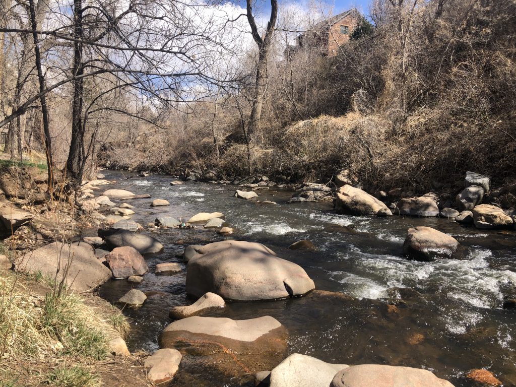 View of Bear Creek along the riverwalk in downtown Morrison, CO